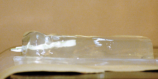 The gel is being hit by the Larcona staple remover fired from the Super Maul. The Larcona is travelling backwards. A wave is starting to take form.